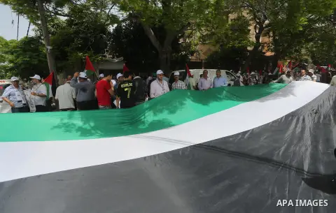 Palestinians wave national flags on May 15, 2016 in Gaza city during a rally to commemorate the "Nakba" or "catastrophe" in Arabic in reference to the establishment in 1948 of the state of Israel. "Nakba" means in Arabic...
