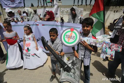 Palestinians wave national flags on May 15, 2016 in Gaza city during a rally to commemorate the "Nakba" or "catastrophe" in Arabic in reference to the establishment in 1948 of the state of Israel. "Nakba" means in Arabic...