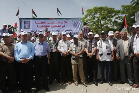 Palestinians wave national flags on May 15, 2016 in Gaza city during a rally to commemorate the "Nakba" or "catastrophe" in Arabic in reference to the establishment in 1948 of the state of Israel. "Nakba" means in Arabic...