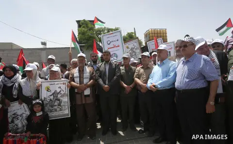 Palestinians wave national flags on May 15, 2016 in Gaza city during a rally to commemorate the "Nakba" or "catastrophe" in Arabic in reference to the establishment in 1948 of the state of Israel. "Nakba" means in Arabic...