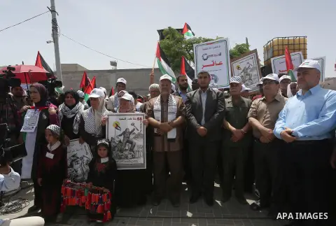 Palestinians wave national flags on May 15, 2016 in Gaza city during a rally to commemorate the "Nakba" or "catastrophe" in Arabic in reference to the establishment in 1948 of the state of Israel. "Nakba" means in Arabic...