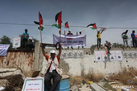 Palestinians wave national flags on May 15, 2016 in Gaza city during a rally to commemorate the "Nakba" or "catastrophe" in Arabic in reference to the establishment in 1948 of the state of Israel. "Nakba" means in Arabic...