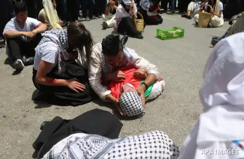 Palestinians re-enact a scene from the 1948 Nakba during a rally marking the 68th anniversary of the Nakba in the West Bank city of Ramallah May 15, 2016. "Nakba" means in Arabic "catastrophe" in reference to the birth o...