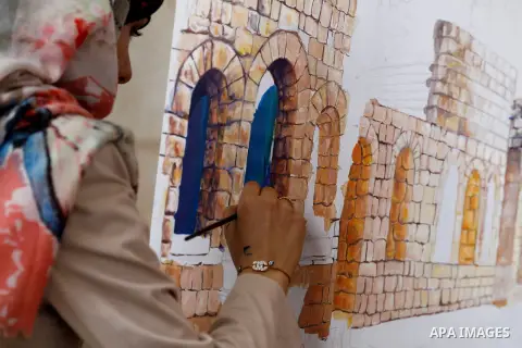 Palestinian artists paint artwork during a rally marking the 68th anniversary of the Nakba in the West Bank city of Hebron May 15, 2016. "Nakba" means in Arabic "catastrophe" in reference to the birth of the state of Isr...