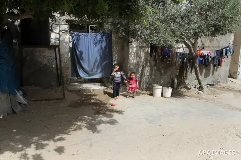 Palestinian children stand outside their family house on the 68th anniversary of the "Nakba" in the southern Gaza Strip town of Khan Younis on May 15, 2016. "Nakba" means in Arabic "catastrophe" in reference to the birth...