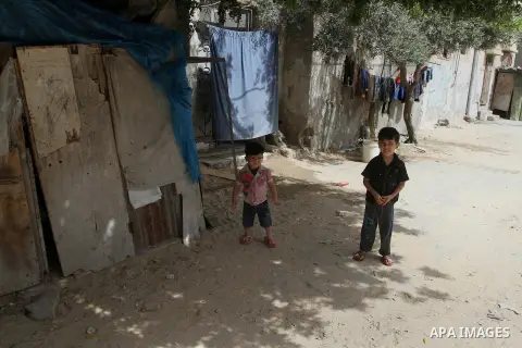 Palestinian children stand outside their family house on the 68th anniversary of the "Nakba" in the southern Gaza Strip town of Khan Younis on May 15, 2016. "Nakba" means in Arabic "catastrophe" in reference to the birth...