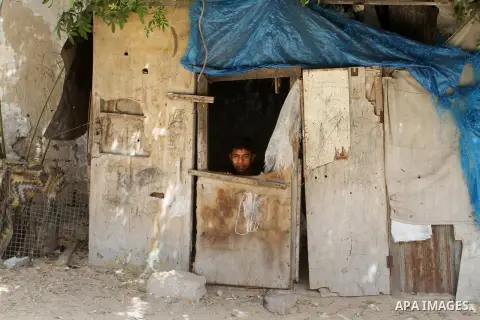 A Palestinian boy stands outside his family house on the 68th anniversary of the "Nakba" in the southern Gaza Strip town of Khan Younis on May 15, 2016. "Nakba" means in Arabic "catastrophe" in reference to the birth of...