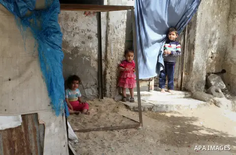 Palestinian children stand outside their family house on the 68th anniversary of the "Nakba" in the southern Gaza Strip town of Khan Younis on May 15, 2016. "Nakba" means in Arabic "catastrophe" in reference to the birth...