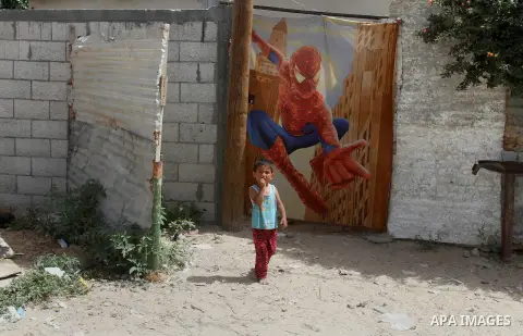 A Palestinian boy stands outside his family house on the 68th anniversary of the "Nakba" in the southern Gaza Strip town of Khan Younis on May 15, 2016. "Nakba" means in Arabic "catastrophe" in reference to the birth of...