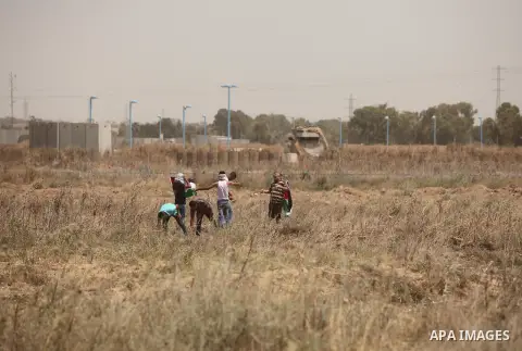 Palestinians take part during a rally to commemorate the "Nakba" or "catastrophe" in Arabic in reference to the establishment in 1948 of the state of Israel near the Nahal Oz crossing east of Gaza City on May 15, 2016. "...