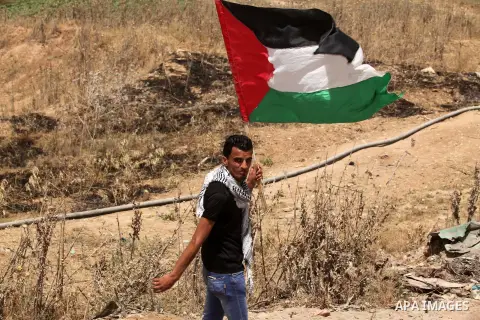 Palestinians take part during a rally to commemorate the "Nakba" or "catastrophe" in Arabic in reference to the establishment in 1948 of the state of Israel near the Nahal Oz crossing east of Gaza City on May 15, 2016. "...