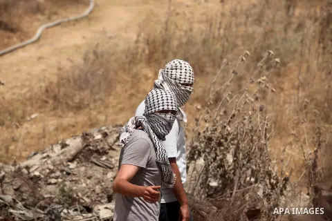 Palestinians take part during a rally to commemorate the "Nakba" or "catastrophe" in Arabic in reference to the establishment in 1948 of the state of Israel near the Nahal Oz crossing east of Gaza City on May 15, 2016. "...