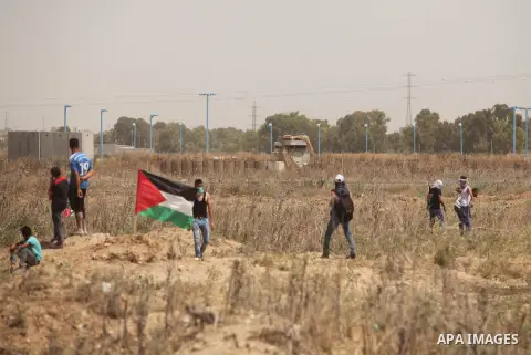 Palestinians take part during a rally to commemorate the "Nakba" or "catastrophe" in Arabic in reference to the establishment in 1948 of the state of Israel near the Nahal Oz crossing east of Gaza City on May 15, 2016. "...