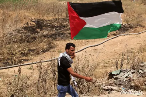 Palestinians take part during a rally to commemorate the "Nakba" or "catastrophe" in Arabic in reference to the establishment in 1948 of the state of Israel near the Nahal Oz crossing east of Gaza City on May 15, 2016. "...