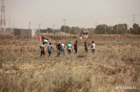 Palestinians take part during a rally to commemorate the "Nakba" or "catastrophe" in Arabic in reference to the establishment in 1948 of the state of Israel near the Nahal Oz crossing east of Gaza City on May 15, 2016. "...