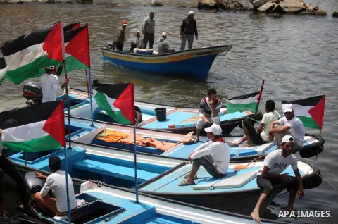 Palestinian patients take part during a protest demanding for treatment abroad, at the Seaport of Gaza City on May 18, 2016. Photo by Ashraf Amra