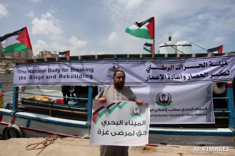 Palestinian patients take part during a protest demanding for treatment abroad, at the Seaport of Gaza City on May 18, 2016. Photo by Ashraf Amra