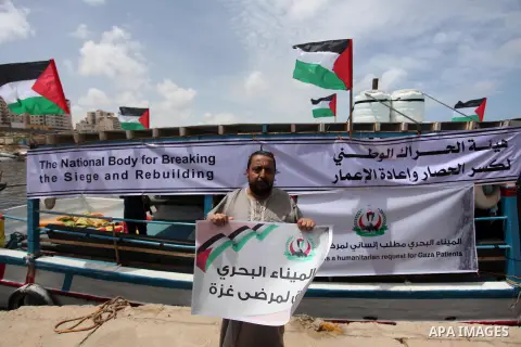Palestinian patients take part during a protest demanding for treatment abroad, at the Seaport of Gaza City on May 18, 2016. Photo by Ashraf Amra