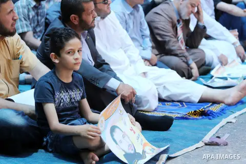 Palestinian supporters of the Islamic Jihad Movement attend Friday prayers to show solidarity with Palestinian prisoners in Israeli Jails, in front of Red cross office in Gaza city, on May 20, 2016. Photo by Mohammed Asa...