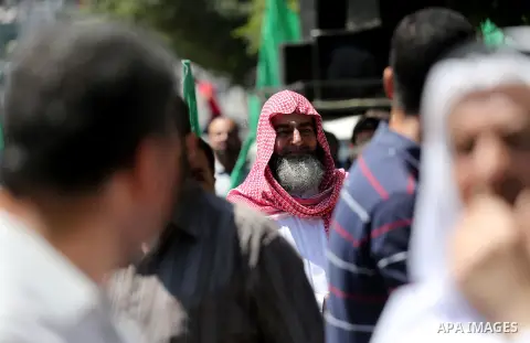 Palestinian supporters of the Islamist movement Hamas take part during a rally to commemorate the 68th anniversary of the "Nakba" or "catastrophe" in Arabic in reference to the establishment in 1948 of the state of Israe...
