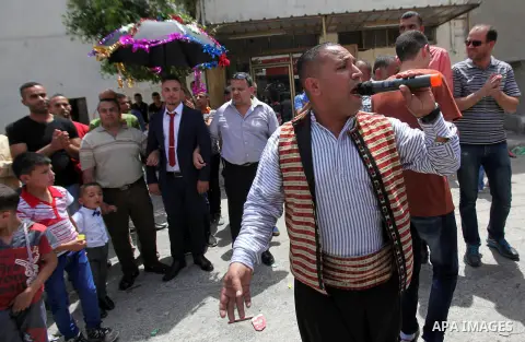 Palestinian friends and relatives celebrated the groom, Mahran Abu Rish, in the West Bank city of Nablus on the eve of his wedding on May 21, 2016, during the traditional celebration, Abu Rish, was first taken by relativ...
