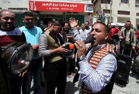 Palestinian friends and relatives celebrated the groom, Mahran Abu Rish, in the West Bank city of Nablus on the eve of his wedding on May 21, 2016, during the traditional celebration, Abu Rish, was first taken by relativ...