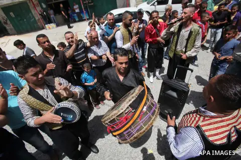 Palestinian friends and relatives celebrated the groom, Mahran Abu Rish, in the West Bank city of Nablus on the eve of his wedding on May 21, 2016, during the traditional celebration, Abu Rish, was first taken by relativ...