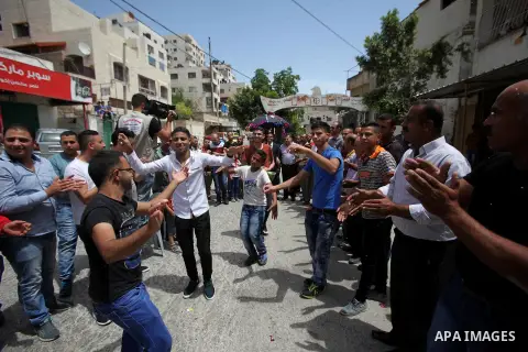 Palestinian friends and relatives celebrated the groom, Mahran Abu Rish, in the West Bank city of Nablus on the eve of his wedding on May 21, 2016, during the traditional celebration, Abu Rish, was first taken by relativ...