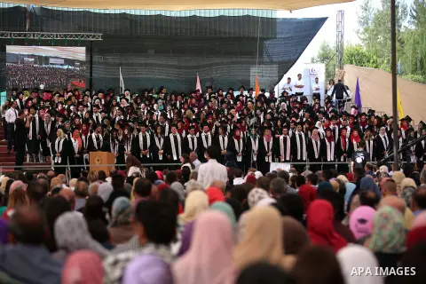 Palestinian students attend their graduation ceremony at the end of the academic year on May 21, 2016 at Birzeit University in the West Bank town of Birzeit, near Ramallah. Photo by Shadi Hatem
