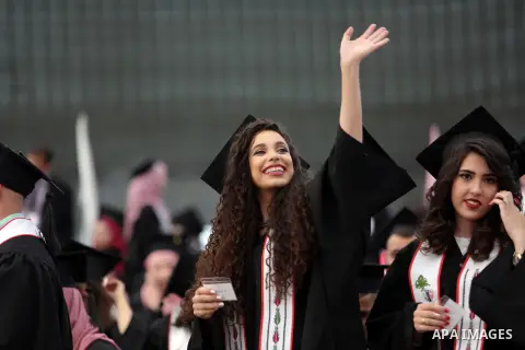 Palestinian students attend their graduation ceremony at the end of the academic year on May 21, 2016 at Birzeit University in the West Bank town of Birzeit, near Ramallah. Photo by Shadi Hatem