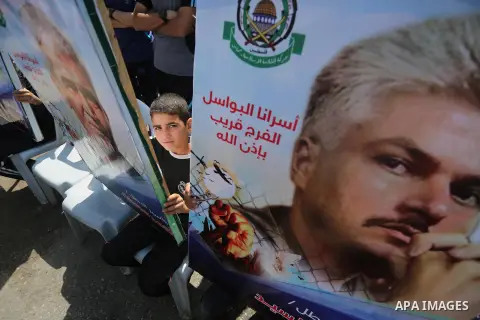 Palestinians gather during a rally marking the 51th anniversary of the Popular Front for the Liberation of Palestine (General Command),in front of Red cross office, in Gaza city, on May 23, 2016. Photo by Mohammed Asad