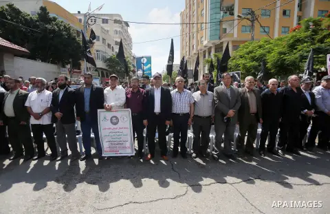 Palestinians gather during a rally marking the 51th anniversary of the Popular Front for the Liberation of Palestine (General Command),in front of Red cross office, in Gaza city, on May 23, 2016. Photo by Mohammed Asad