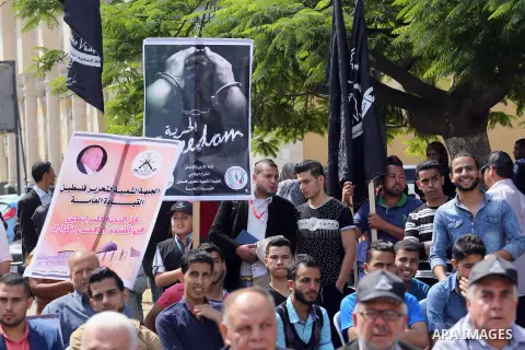 Palestinians gather during a rally marking the 51th anniversary of the Popular Front for the Liberation of Palestine (General Command),in front of Red cross office, in Gaza city, on May 23, 2016. Photo by Mohammed Asad