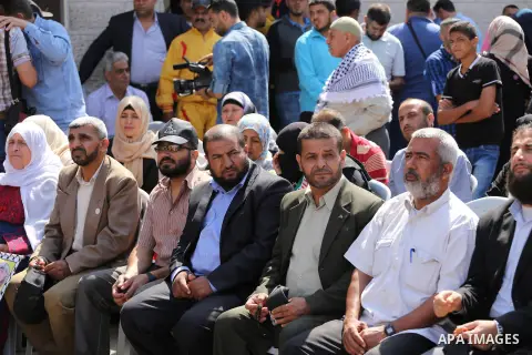 Palestinians gather during a rally marking the 51th anniversary of the Popular Front for the Liberation of Palestine (General Command),in front of Red cross office, in Gaza city, on May 23, 2016. Photo by Mohammed Asad
