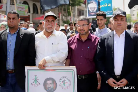 Palestinians gather during a rally marking the 51th anniversary of the Popular Front for the Liberation of Palestine (General Command),in front of Red cross office, in Gaza city, on May 23, 2016. Photo by Mohammed Asad