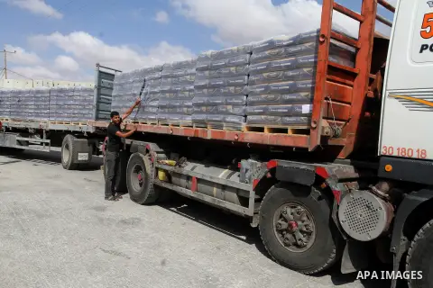 Loaded trucks cross the Kerem Shalom crossing to Rafah in southern Gaza Strip on May 23, 2016. Israel said on May 22 it was lifting a ban imposed last month on private imports of cement to the Hamas-run Gaza Strip. The b...