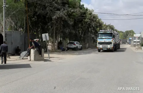 Loaded trucks cross the Kerem Shalom crossing to Rafah in southern Gaza Strip on May 23, 2016. Israel said on May 22 it was lifting a ban imposed last month on private imports of cement to the Hamas-run Gaza Strip. The b...