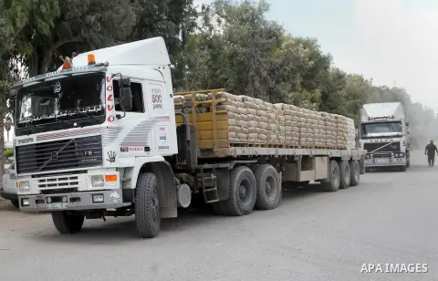 Loaded trucks cross the Kerem Shalom crossing to Rafah in southern Gaza Strip on May 23, 2016. Israel said on May 22 it was lifting a ban imposed last month on private imports of cement to the Hamas-run Gaza Strip. The b...
