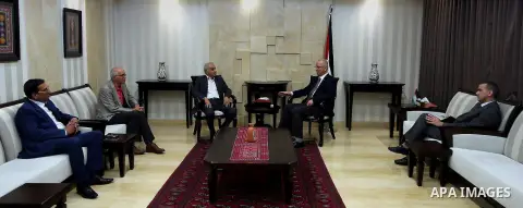 Palestinian Prime Minister, Rami Hamdallah, meets with Chairman of the Independent National Commission Farid al-Jallad, in the West Bank city of Ramallah, on May 23, 2016. Photo by Prime Minister Office