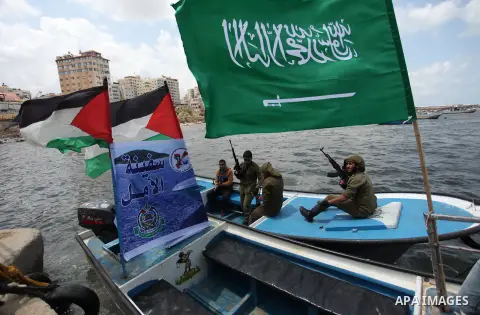 Palestinians take part in a protest against the Israeli blockade of the Gaza Strip at the Gaza seaport, on May 24, 2016. Photo by Ashraf Amra