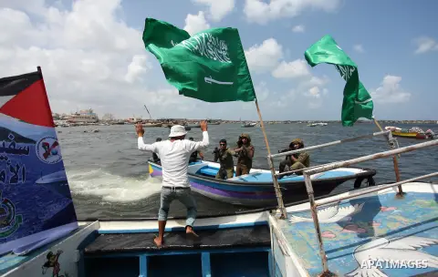 Palestinians take part in a protest against the Israeli blockade of the Gaza Strip at the Gaza seaport, on May 24, 2016. Photo by Ashraf Amra