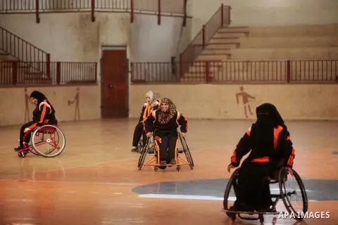 Disabled Palestinians take part in a training course to play basketball organised by the Palestinian Red Cross, in Khan Younis in the southern Gaza strip, on May 28, 2016. Photo by Ashraf Amra
