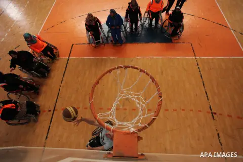 Disabled Palestinians take part in a training course to play basketball organised by the Palestinian Red Cross in Khan Younis in the southern Gaza strip, on May 28, 2016. Photo by Ashraf Amra