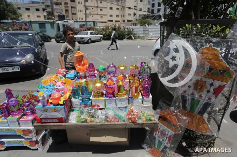 A Palestinian vendor displays a traditional lantern known in Arabic as "Fanous" in a market in Gaza city as the faithful prepare for the start of the Muslim holy fasting month of Ramadan on May 31, 2016. More than 1.5 bi...