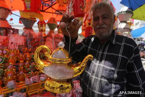 A Palestinian vendor displays a traditional lantern known in Arabic as "Fanous" in a market in Gaza city as the faithful prepare for the start of the Muslim holy fasting month of Ramadan on May 31, 2016. More than 1.5 bi...
