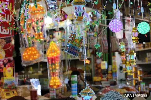 A Palestinian vendor displays a traditional lantern known in Arabic as "Fanous" in a market in Gaza city as the faithful prepare for the start of the Muslim holy fasting month of Ramadan on May 31, 2016. More than 1.5 bi...
