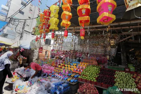 A Palestinian vendor displays a traditional lantern known in Arabic as "Fanous" in a market in Gaza city as the faithful prepare for the start of the Muslim holy fasting month of Ramadan on May 31, 2016. More than 1.5 bi...