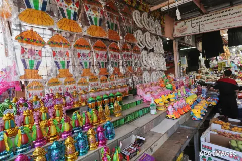A Palestinian vendor displays a traditional lantern known in Arabic as "Fanous" in a market in Gaza city as the faithful prepare for the start of the Muslim holy fasting month of Ramadan on May 31, 2016. More than 1.5 bi...