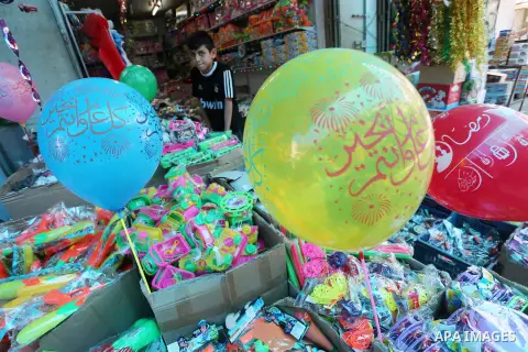 A Palestinian vendor displays a traditional lantern known in Arabic as "Fanous" and toys in a market in Gaza city as the faithful prepare for the start of the Muslim holy fasting month of Ramadan on May 31, 2016. More th...