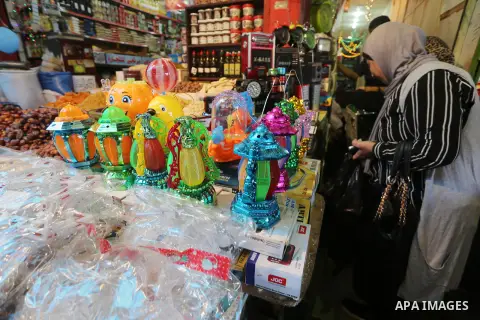 A Palestinian vendor displays a traditional lantern known in Arabic as "Fanous" in a market in Gaza city as the faithful prepare for the start of the Muslim holy fasting month of Ramadan on May 31, 2016. More than 1.5 bi...